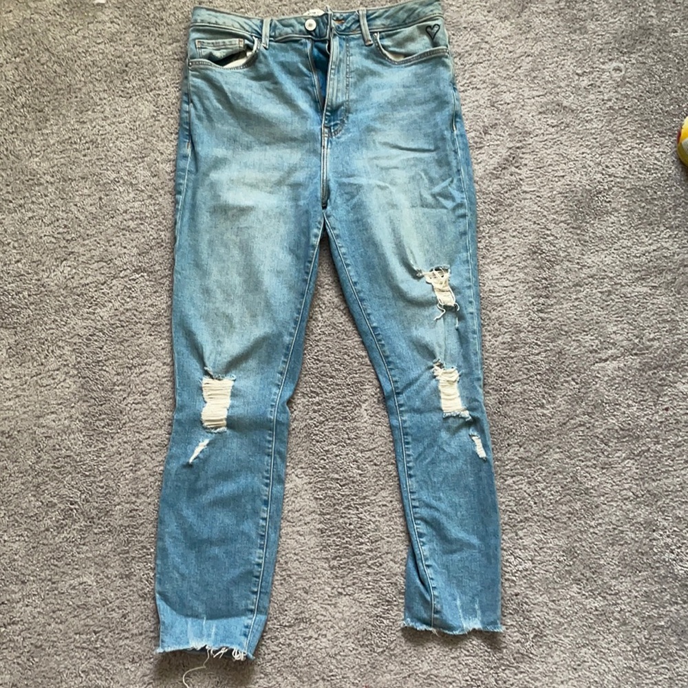 blue jeans w a heart symbol on the corner